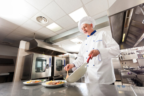 Portrait of a chef preparing a dish